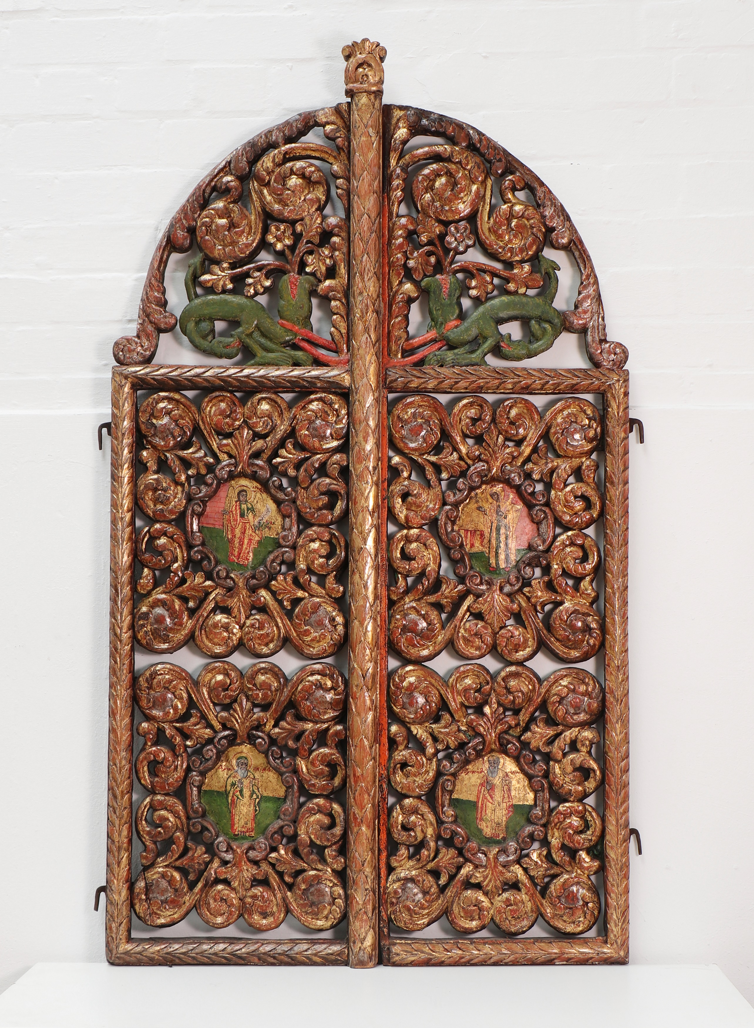 A pair of carved and pierced giltwood Royal doors